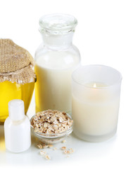 Honey and milk spa with oils and honey isolated on white