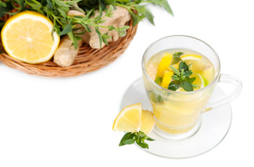 Cup of tea with ginger isolated on white