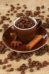 Coffee beans in cup on table close-up