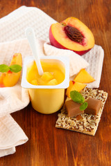 Tasty yogurt with pieces of fresh fruits, cookies and flakes,on