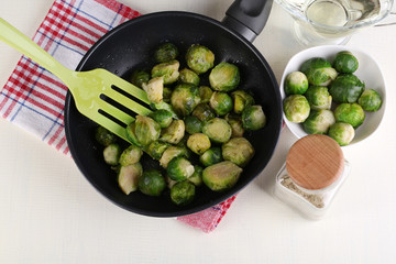 Fresh brussels sprouts in pan with vegetables and spices