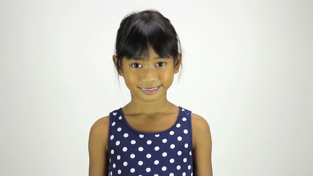 Cute Little Asian Girl Smiling At Camera
