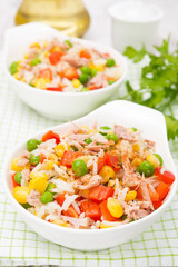 colorful salad with corn, green peas, rice, red pepper, tuna