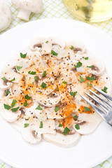salad of fresh mushrooms with pepper, olive oil, parsley