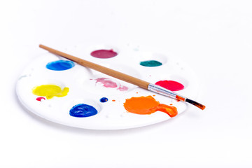 Palette and brushes.Paintbrush and palette on white.