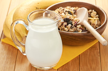 Plate with raw oatmeal on wooden table.