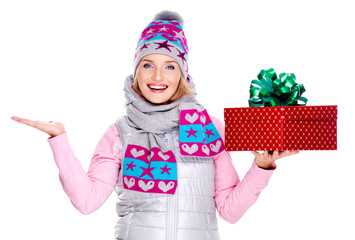 woman with a gift and copy space in another  hand