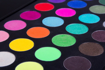 Make up colorful eyeshadow palettes over black