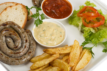 Bavarian sausages on the grill, french fries