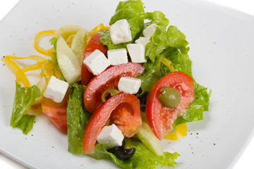  Greek salad in plate isolated on white