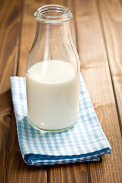 milk in glass jar on napkin