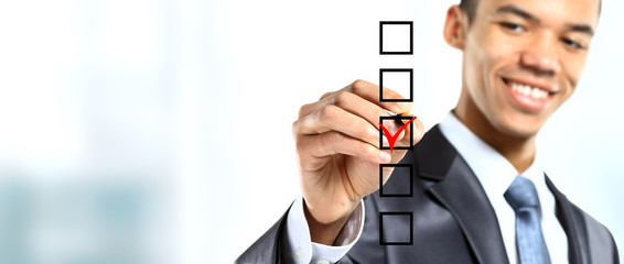 african businessman choosing one of three options