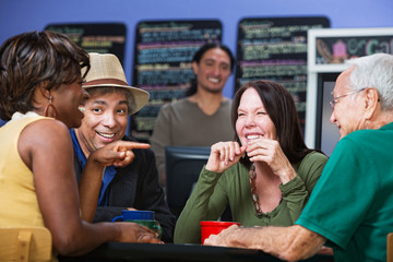 Obraz premium Merry Adults in Cafe