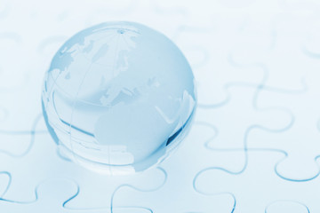 Crystal glass globe ball on puzzle