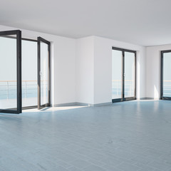 Bright empty room with large windows and a balcony