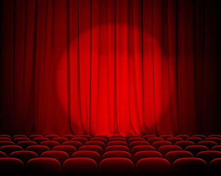 closed theater red curtains with spotlight and seats