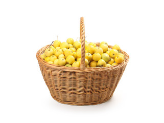 yellow apples in a wicker basket