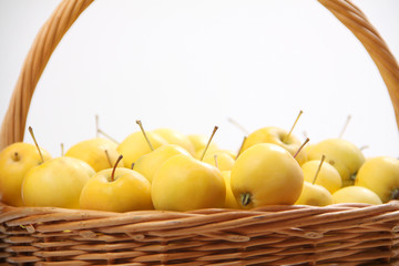 yellow apples in a wicker basket