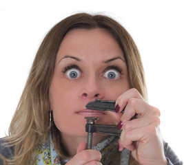 women needs to shut up, she holding a clamp on her mouth 