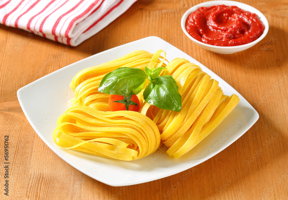 Sticker tagliatelle pasta and tomato paste