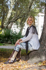 sitting blonde autumn girl