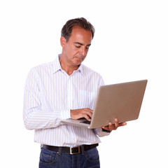 Hispanic man working with his laptop