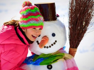 winter playing with snowman