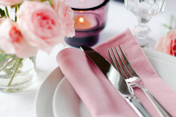 Beautiful festive table setting with roses