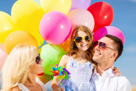 family with colorful balloons