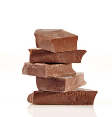 Chocolate pieces on a white background