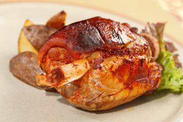 roasted pork knuckle with potatoes