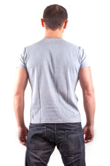Fototapeta premium Backside view of young man isolated on white background