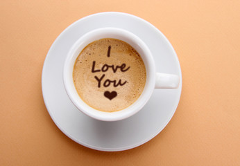 Cup of fresh coffee with words 