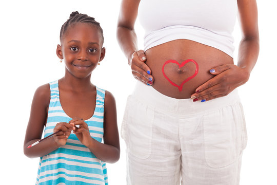 Little african american girl painting on her mother's belly - Af