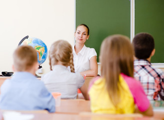 School children in classroom at lesson