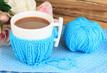 Cup with knitted thing on it close up