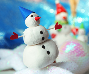 Beautiful snowmen and Christmas decor, on bright background