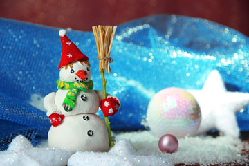 Beautiful snowman and Christmas decor, on bright background