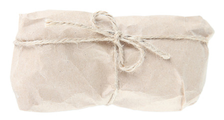 Telephone wrapped in brown kraft paper, isolated on white