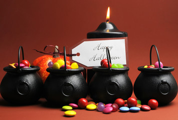 Row of Halloween Trick or Treat witches cauldrons