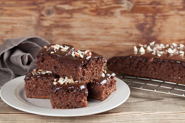 Fototapeta na wymiar Gingerbread cake with chocolate and hazelnuts