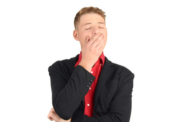 Tired and bored business man yawning. Isolated on white.
