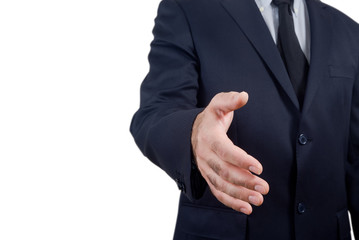 businessman holds out his hand to make a deal