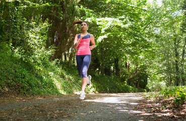 Obraz na płótnie Canvas Pretty young woman jogging