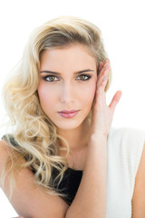 Fototapeta premium Slightly smiling blonde model looking at camera