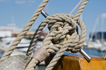 Fototapeta na wymiar Blocks and rigging at the old sailboat, close-up