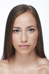Obraz premium Portrait of young woman against white background