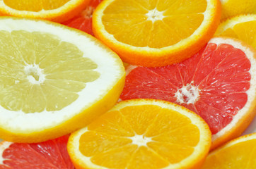 sliced citrus fruits: orange, grapefruit