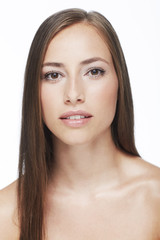 Obraz premium Portrait of young woman against white background