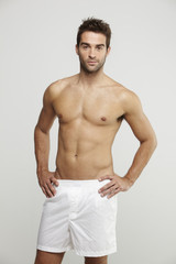 Portrait of mid adult man in boxer shorts